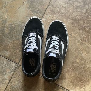 Black and white low top Vans